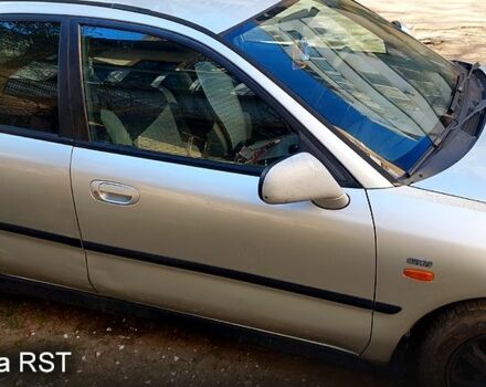 Серый Мицубиси Харизма, объемом двигателя 1.8 л и пробегом 320 тыс. км за 1600 $, фото 3 на Automoto.ua