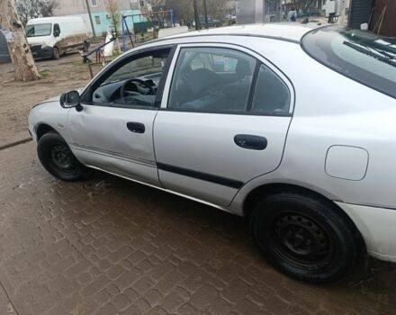 Серый Мицубиси Харизма, объемом двигателя 1.9 л и пробегом 280 тыс. км за 700 $, фото 2 на Automoto.ua