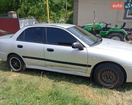 Серый Мицубиси Харизма, объемом двигателя 1.8 л и пробегом 416 тыс. км за 2800 $, фото 3 на Automoto.ua