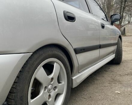 Серый Мицубиси Харизма, объемом двигателя 1.8 л и пробегом 265 тыс. км за 2850 $, фото 4 на Automoto.ua