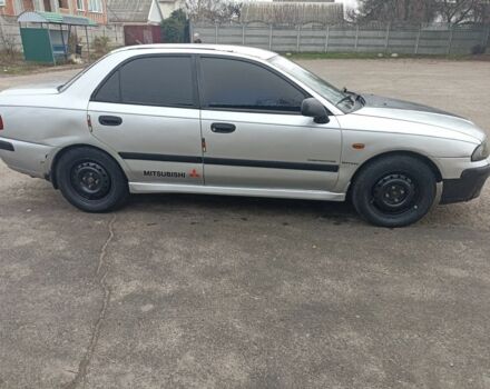 Сірий Міцубісі Харизма, об'ємом двигуна 1.8 л та пробігом 371 тис. км за 2200 $, фото 2 на Automoto.ua