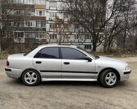 Сірий Міцубісі Харизма, об'ємом двигуна 1.83 л та пробігом 265 тис. км за 2850 $, фото 2 на Automoto.ua