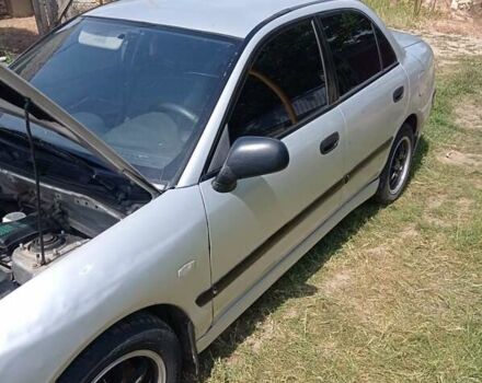 Серый Мицубиси Харизма, объемом двигателя 1.8 л и пробегом 416 тыс. км за 2800 $, фото 19 на Automoto.ua