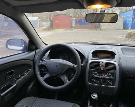 Сірий Міцубісі Харизма, об'ємом двигуна 1.83 л та пробігом 265 тис. км за 2850 $, фото 15 на Automoto.ua