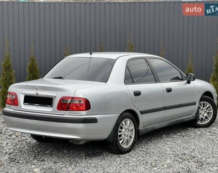 Серый Мицубиси Харизма, объемом двигателя 1.83 л и пробегом 326 тыс. км за 3400 $, фото 4 на Automoto.ua