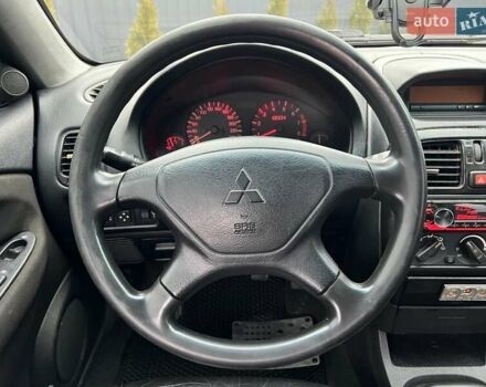 Серый Мицубиси Харизма, объемом двигателя 1.83 л и пробегом 326 тыс. км за 3400 $, фото 12 на Automoto.ua