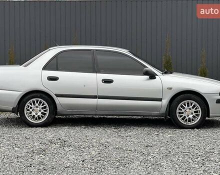 Серый Мицубиси Харизма, объемом двигателя 1.83 л и пробегом 326 тыс. км за 3400 $, фото 2 на Automoto.ua