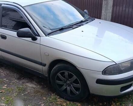 Серый Мицубиси Харизма, объемом двигателя 1.6 л и пробегом 226 тыс. км за 3000 $, фото 1 на Automoto.ua