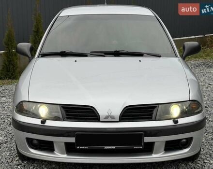 Серый Мицубиси Харизма, объемом двигателя 1.83 л и пробегом 326 тыс. км за 3400 $, фото 1 на Automoto.ua