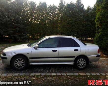 Серый Мицубиси Харизма, объемом двигателя 1.6 л и пробегом 310 тыс. км за 2150 $, фото 1 на Automoto.ua