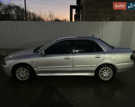 Серый Мицубиси Харизма, объемом двигателя 1.6 л и пробегом 300 тыс. км за 2800 $, фото 1 на Automoto.ua