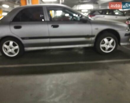 Серый Мицубиси Харизма, объемом двигателя 1.6 л и пробегом 270 тыс. км за 2300 $, фото 1 на Automoto.ua