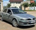 Серый Мицубиси Харизма, объемом двигателя 1.6 л и пробегом 245 тыс. км за 2100 $, фото 1 на Automoto.ua