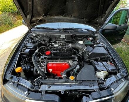 Серый Мицубиси Харизма, объемом двигателя 1.6 л и пробегом 0 тыс. км за 3200 $, фото 1 на Automoto.ua