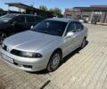 Серый Мицубиси Харизма, объемом двигателя 1.6 л и пробегом 255 тыс. км за 3800 $, фото 1 на Automoto.ua