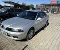 Серый Мицубиси Харизма, объемом двигателя 1.6 л и пробегом 255 тыс. км за 3800 $, фото 1 на Automoto.ua