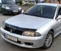 Серый Мицубиси Харизма, объемом двигателя 1.6 л и пробегом 310 тыс. км за 4000 $, фото 1 на Automoto.ua