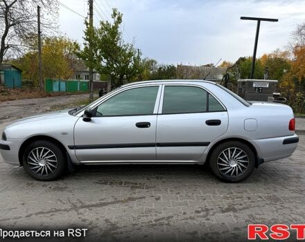 Сірий Міцубісі Харизма, об'ємом двигуна 1.6 л та пробігом 184 тис. км за 3900 $, фото 4 на Automoto.ua