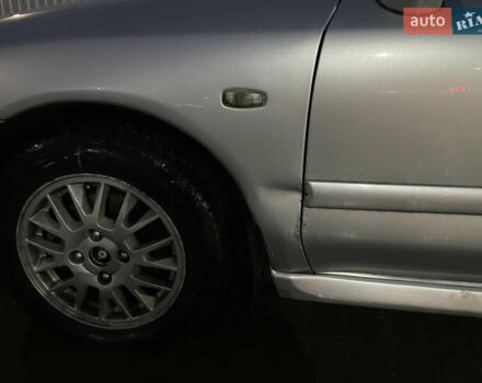 Серый Мицубиси Харизма, объемом двигателя 1.6 л и пробегом 300 тыс. км за 2800 $, фото 3 на Automoto.ua