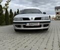 Сірий Міцубісі Харизма, об'ємом двигуна 1.83 л та пробігом 319 тис. км за 4500 $, фото 1 на Automoto.ua