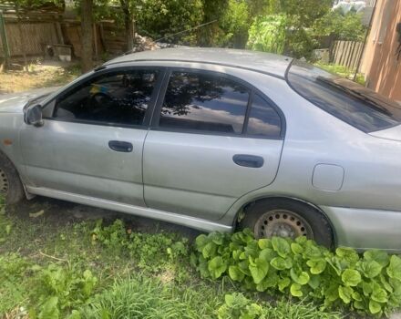 Серый Мицубиси Харизма, объемом двигателя 1.8 л и пробегом 202 тыс. км за 1100 $, фото 2 на Automoto.ua