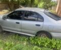 Серый Мицубиси Харизма, объемом двигателя 1.8 л и пробегом 202 тыс. км за 1100 $, фото 2 на Automoto.ua