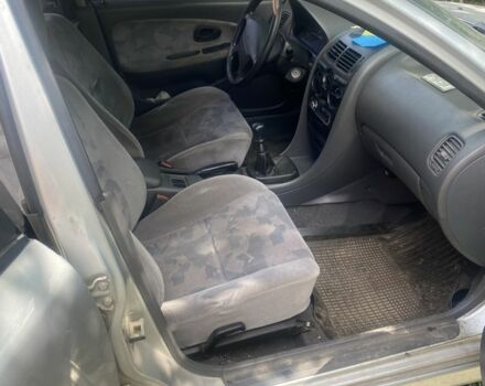 Серый Мицубиси Харизма, объемом двигателя 1.8 л и пробегом 202 тыс. км за 1100 $, фото 6 на Automoto.ua