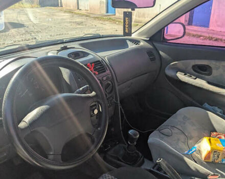 Серый Мицубиси Харизма, объемом двигателя 1.83 л и пробегом 415 тыс. км за 1999 $, фото 6 на Automoto.ua