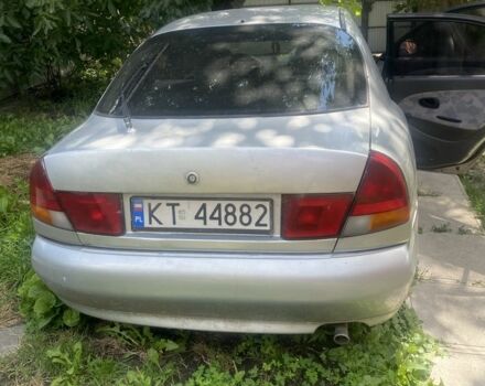 Серый Мицубиси Харизма, объемом двигателя 1.8 л и пробегом 202 тыс. км за 1100 $, фото 4 на Automoto.ua