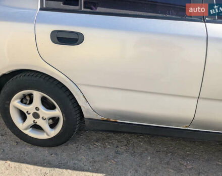 Серый Мицубиси Харизма, объемом двигателя 1.83 л и пробегом 415 тыс. км за 1999 $, фото 2 на Automoto.ua