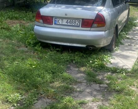 Серый Мицубиси Харизма, объемом двигателя 1.8 л и пробегом 202 тыс. км за 1100 $, фото 1 на Automoto.ua