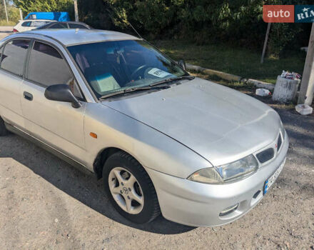 Серый Мицубиси Харизма, объемом двигателя 1.83 л и пробегом 415 тыс. км за 1999 $, фото 4 на Automoto.ua