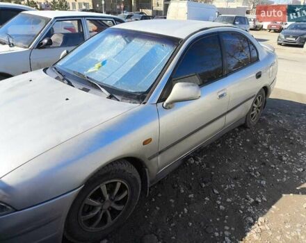 Сірий Міцубісі Харизма, об'ємом двигуна 1.8 л та пробігом 300 тис. км за 1800 $, фото 1 на Automoto.ua