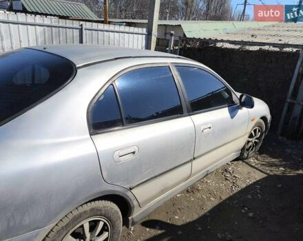 Сірий Міцубісі Харизма, об'ємом двигуна 1.8 л та пробігом 300 тис. км за 1800 $, фото 2 на Automoto.ua