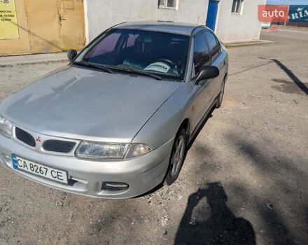 Серый Мицубиси Харизма, объемом двигателя 1.83 л и пробегом 415 тыс. км за 1999 $, фото 3 на Automoto.ua