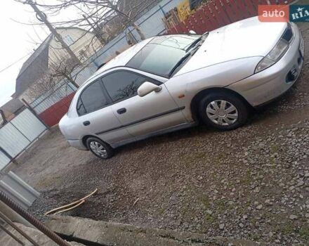 Серый Мицубиси Харизма, объемом двигателя 1.9 л и пробегом 65 тыс. км за 1650 $, фото 7 на Automoto.ua