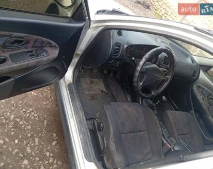 Серый Мицубиси Харизма, объемом двигателя 1.9 л и пробегом 65 тыс. км за 1650 $, фото 1 на Automoto.ua