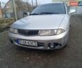 Серый Мицубиси Харизма, объемом двигателя 1.9 л и пробегом 65 тыс. км за 1650 $, фото 1 на Automoto.ua