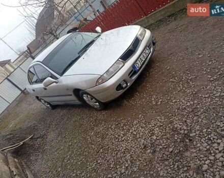 Серый Мицубиси Харизма, объемом двигателя 1.9 л и пробегом 65 тыс. км за 1650 $, фото 17 на Automoto.ua