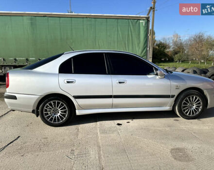 Сірий Міцубісі Харизма, об'ємом двигуна 1.83 л та пробігом 258 тис. км за 4200 $, фото 9 на Automoto.ua