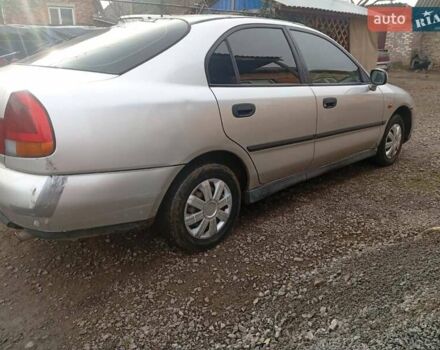 Серый Мицубиси Харизма, объемом двигателя 1.9 л и пробегом 65 тыс. км за 1650 $, фото 4 на Automoto.ua