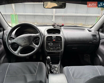 Сірий Міцубісі Харизма, об'ємом двигуна 1.6 л та пробігом 398 тис. км за 2500 $, фото 4 на Automoto.ua