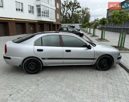 Сірий Міцубісі Харизма, об'ємом двигуна 1.6 л та пробігом 398 тис. км за 2500 $, фото 2 на Automoto.ua