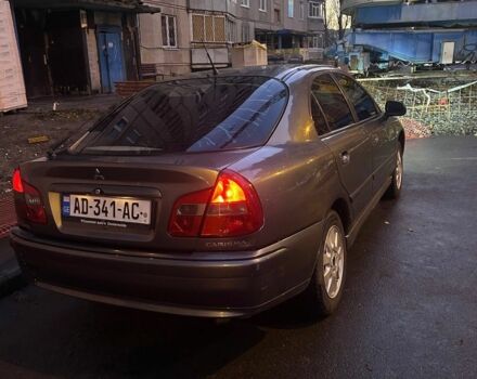 Серый Мицубиси Харизма, объемом двигателя 1.8 л и пробегом 377 тыс. км за 1182 $, фото 2 на Automoto.ua