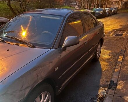 Серый Мицубиси Харизма, объемом двигателя 1.8 л и пробегом 377 тыс. км за 1182 $, фото 1 на Automoto.ua