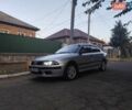 Серый Мицубиси Харизма, объемом двигателя 1.83 л и пробегом 348 тыс. км за 3800 $, фото 1 на Automoto.ua