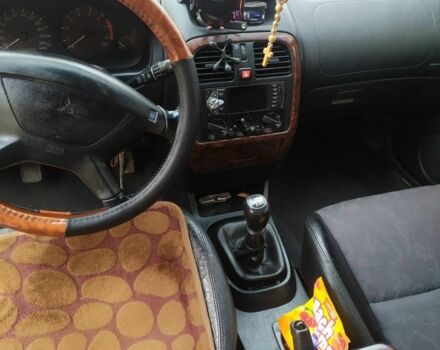 Серый Мицубиси Харизма, объемом двигателя 1.6 л и пробегом 330 тыс. км за 2800 $, фото 16 на Automoto.ua