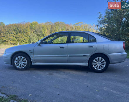 Серый Мицубиси Харизма, объемом двигателя 1.8 л и пробегом 214 тыс. км за 5650 $, фото 1 на Automoto.ua