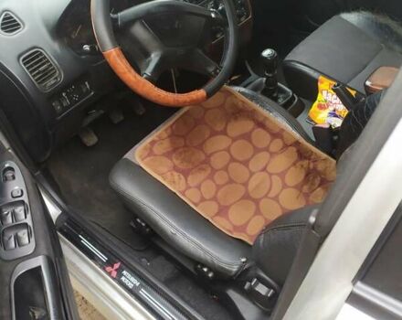 Сірий Міцубісі Харизма, об'ємом двигуна 1.6 л та пробігом 330 тис. км за 2800 $, фото 13 на Automoto.ua