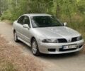 Серый Мицубиси Харизма, объемом двигателя 1.8 л и пробегом 265 тыс. км за 3500 $, фото 1 на Automoto.ua